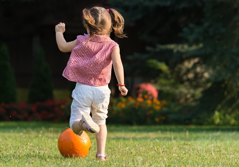 Girl kicking ball